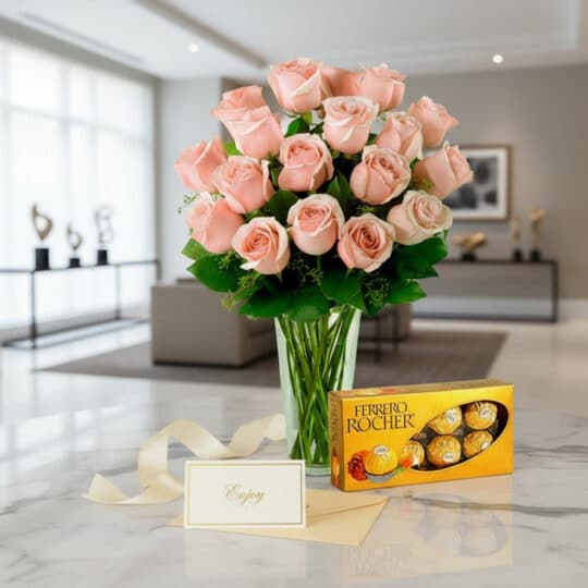 Jarrón Decídete con un hermoso arreglo de rosas rosadas frescas, acompañado de una caja de chocolates Ferrero Rocher, sobre u